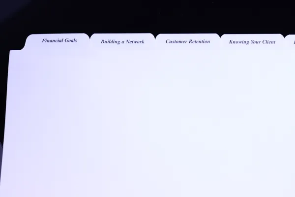 Five-bank set of printed advisor binder tabs across the top edge