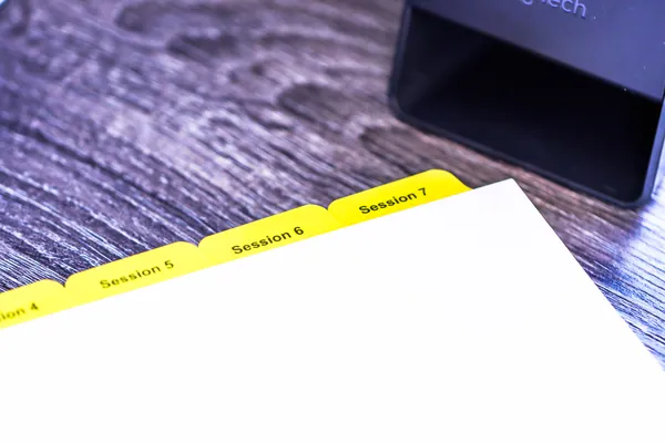 Yellow Mylar index tabs printed Session 5, Session 6 and Session 7 for a training binder
